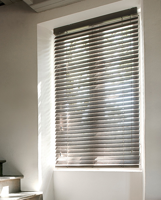 Decorquip dark grey Real Wood Venetian blind partially open on a sunlit window