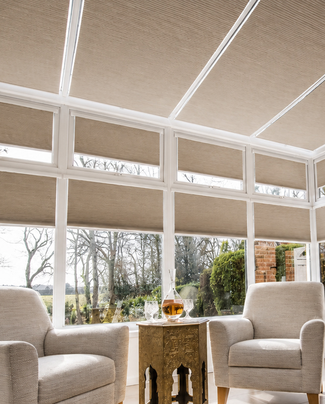 Decorquip beige tensioned window and roof pleated conservatory blinds fitted across roof and windows